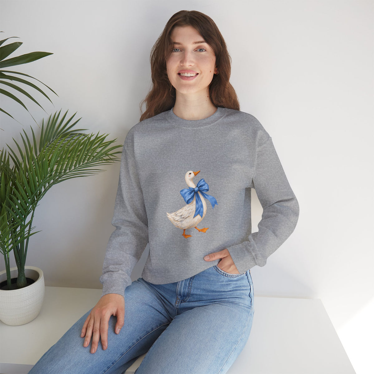Cute Duck with blue bow Unisex Heavy Blend™ Crewneck Sweatshirt